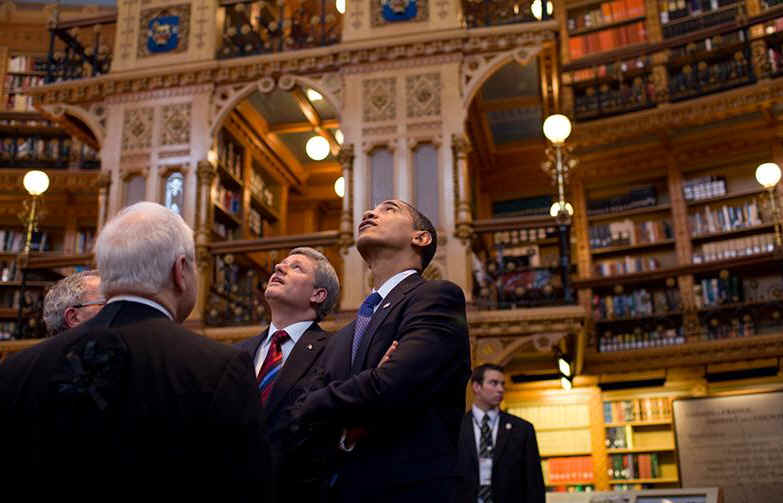 President Obama and Canadian Prime Minister Stephen Harper look up in the Parliament Library. President Barack Obama packs a busy schedule for his one-day visit to Ottawa, Canada on February 19, 2009.