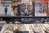 Amsterdam Netherlands newsstand displays Barack Obama's presidential victory in headlines.