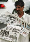 Islamabad Pakistan newsstand displays Barack Obama's presidential victory in headlines.