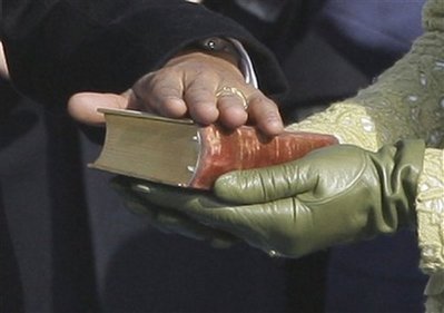 Michelle Obama holds Lincoln Bible from 1861 Inauguration for swearing-in ceremony of President Barack Obama.