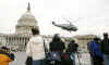 A helicopter departs the East Front of the Capitol Building rehearsing President Bush's flight to Andrews Air Force Base.
