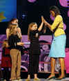 Michelle Obama delivered remarks at the Kids Inaugural: We Are The Future. Michelle attended with daughters Sasha and Malia and members of the Biden family. Barack and Michelle Obama do their pre-inauguration duties the day before Obama's inauguration.