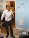 Barack Obama continues his National Day of Service by painting walls, cabinets, and drawers at Sasha Bruce House, an emergency shelter for homeless and runaway teens in Washington. Martin Luther King III worked alongside Obama.