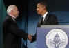 Barack Obama shakes hands with John McCain at the bipartisan dinner in honor of Senator John McCain. Barack and Michelle Obama do their pre-inauguration duties the day before Obama's inauguration.