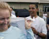 Barack Obama autographs a T-shirt after his workout at the Semper Fit gym in Kailua Hawaii on January 1, 2009, his last day of the Obama family Hawaii vacation.