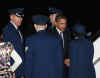Barack Obama greets military personnel after arriving at Andrews Air Force Base in Maryland after arriving on a 757 military charter on January 4, 2009 enroute to see family at hotel in Washington, DC
