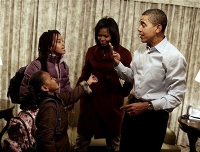 Barack and Michelle Obama get Sasha and Malia ready for their first day of school at Lower School Campus of Sidwell Friends in Bethesda, Maryland on January 5, 2009. Obama and his family are staying at the Hay-Adams Hotel in Washington, DC.