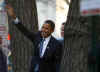Barack Obama waves to supporters after leaving the Presidential Inaugural Committee offices in Washington.