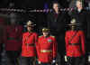 Officers of the Royal Canadian Mounted Police (RCMP) enjoy the Inaugural parade as it passes by the Canadian Embassy.