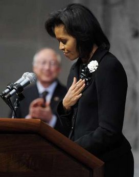 First Lady Michelle Obama speaks at the Department of the Interior. Michelle received a shawl from the Bureau of Indian Affairs.