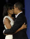 President Barack Obama and First Lady Michelle Obama kiss at the Eastern Inaugural Ball at Union Station.