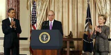 President Obama picks George Mitchell (speaking) as envoy to the Middle East.