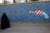 Iranian President Mahmoud Ahmandinejad said Obama's willingness to talk shows a deep fundamental change in the US and says this shows the US policy of domination has failed. Iran's president also said the Iran Islamic Revolution is not limited to Iran's borders (graph above). Photo:  Mural on the wall of the former US Embassy in Tehran on January 28, 2009.
