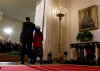 President Barack Obama signs his first bill into law as president in the East Room of the White House on January 29, 2009. President Obama signs the Lilly Ledbetter Fair Pay Act designed to eliminate pay inequities based on sex discrimination. Members of Congress. Hillary Clinton, and others join in witnessing the historic moment of Obama's signing of his first bill.