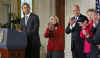 President Barack Obama signs his first bill into law as president in the East Room of the White House on January 29, 2009. President Obama signs the Lilly Ledbetter Fair Pay Act designed to eliminate pay inequities based on sex discrimination. Members of Congress. Hillary Clinton, and others join in witnessing the historic moment of Obama's signing of his first bill.