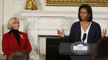 Michelle Obama hosts a function in the State Dining Room of the White House for Lilly Ledbetter (left) after the historic signing of a bill in her name.