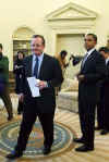 President Barack Obama meets with the press in the Oval Office of the White House. With Treasury Secretary Timothy Geithner at his side, Obama was visibly upset with Wall Street's recent multi-billion dollar bonuses to top executives. President Obama called Wall Street bonuses as "shameful" and irresponsible.