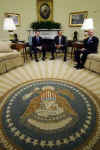 President Barack Obama meets with the press in the Oval Office of the White House. With Treasury Secretary Timothy Geithner at his side, Obama was visibly upset with Wall Street's recent multi-billion dollar bonuses to top executives. President Obama called Wall Street bonuses as "shameful" and irresponsible.