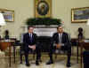 President Barack Obama meets with the press in the Oval Office of the White House. With Treasury Secretary Timothy Geithner at his side, Obama was visibly upset with Wall Street's recent multi-billion dollar bonuses to top executives. President Obama called Wall Street bonuses as "shameful" and irresponsible.