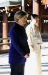 Secretary of State Hillary Clinton visits the Meiji Shrine in Tokyo. Temple priests guide Clinton through the shrine and prepare her for prayers (photo) and a sacred tree branch offering on February 17, 2009.