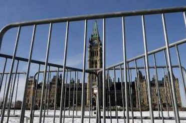 Security preparations continue on Parliament Hill in Ottawa just 48 hours before President Barack Obama's visit to Canada. RCMP and US Secret Service prepare to secure the Parliament grounds, including the installation of concealment tarps, bullet proof glass, and street and pedestrian barriers (photo).