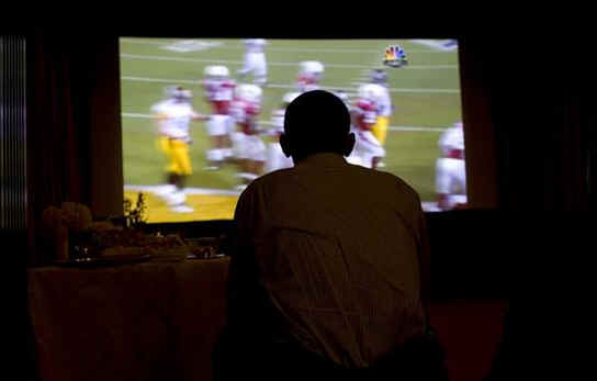 President Barack Obama watches Super Bowl XLIII at the White House residence.