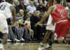 President Obama and his friend Marty Nesbitt watch the NBA match between the Washington Wizards and the Chicago Bulls at the Verizon Center in Washington. Obama is a Bulls fan, however the Wizards won the game 113-90.