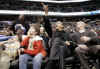Obama points to screen. President Obama and his friend Marty Nesbitt watch the NBA match between the Washington Wizards and the Chicago Bulls at the Verizon Center in Washington. Obama is a Bulls fan, however the Wizards won the game 113-90.