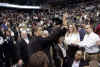 Obama waves as he leaves NBA game. President Obama and his friend Marty Nesbitt watch the NBA match between the Washington Wizards and the Chicago Bulls at the Verizon Center in Washington. Obama is a Bulls fan, however the Wizards won the game 113-90.