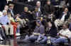 President Obama and his friend Marty Nesbitt watch the NBA match between the Washington Wizards and the Chicago Bulls at the Verizon Center in Washington. Obama is a Bulls fan, however the Wizards won the game 113-90.