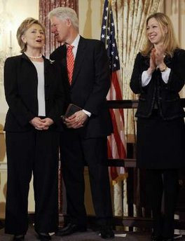 Hillary Clinton is officially sworn in as US Secretary of State by Vice President Joe Biden at the State Department in Washington on February 2, 2009. Guests for the ceremony included former Secretaries of State James Baker and Henry Kissinger. and celebrities like Chevy Chase. Daughter Chelsea and husband Bill Clinton joined the ceremony, with former President Bill Clinton holding the Bible for the swear-in.