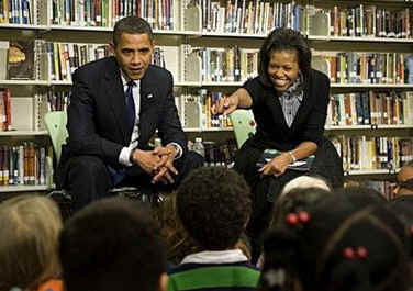 First Lady Michelle Obama and President Barack Obama meet with second graders at Capitol City Public Charter School. The President and First Lady read the children a book on the Apollo 11 moon landing called "Moon Over Star" on February 3, 2009.