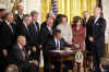 President Barack Obama signs the $32.8 billion State Children's Health Insurance Program in the East Room of the White House on February 4, 2009.