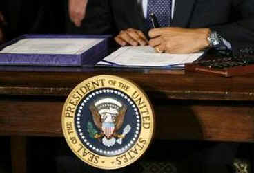 President Barack Obama signs the $32.8 billion State Children's Health Insurance Program in the East Room of the White House on February 4, 2009.