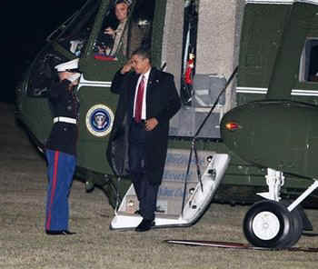 President Barack Obama boards Marine One for the first time as President. Marine One picks up Obama on the South Lawn of the White House enroute to Andrews Air Force Base and returns after attending Williamsburg conference.