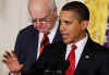 President Barack Obama signs an executive order in the East Room of the White House with Paul Vocker the Chairman of the Economic Recovery Advisory Board.