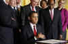 President Barack Obama signs an executive order in the East Room of the White House with Paul Vocker the Chairman of the Economic Recovery Advisory Board.