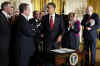 President Barack Obama signs an executive order in the East Room of the White House with Paul Vocker the Chairman of the Economic Recovery Advisory Board.