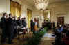 President Barack Obama signs an executive order in the East Room of the White House with Paul Vocker the Chairman of the Economic Recovery Advisory Board.