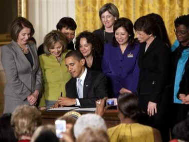 President Obama signs an Executive Order creating the Women and Girls Council aimed at high level reform on women's issues.