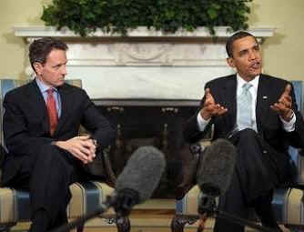 President Barack Obama talks with reporters in the Oval Office after Obama's daily financial briefing from Treasury Secretary Tim Geithner on March 11, 2009.