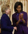 First Lady Michelle Obama and Secretary of State Hillary Clinton join in presenting the Secretary of State's International Women of Courage awards to women recipients from around the world on March 11, 2009.