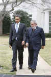 President Barack Obama escorts Da Silva across the South Lawn of the White House to a waiting limousine.