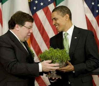 President Barack Obama is given a bowl of shamrocks by Irish Prime Minister Brian Cowen at the annual Shamrock Ceremony n the Roosevelt Room of the White House on St. Patrick's Day, March 17, 2009.