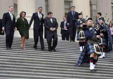 President Barack Obama leaves the Capitol Building after a St. Patrick's Day luncheon with Ireland's Prime Minister Brian Cowen. President Obama. led by a bagpiper, walks down the Capitol Hill stairs with PM Brian Cowen, and Speaker of the House Nancy Pelosi.