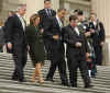 President Barack Obama leaves the Capitol Building after a St. Patrick's Day luncheon with Ireland's Prime Minister Brian Cowen. President Obama. led by a bagpiper, walks down the Capitol Hill stairs with PM Brian Cowen, and Speaker of the House Nancy Pelosi.