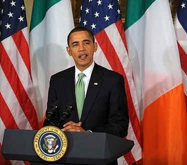 President Barack Obama speaks and is given a bowl of shamrocks by Irish Prime Minister Brian Cowen at the annual Shamrock Ceremony n the Roosevelt Room of the White House on St. Patrick's Day, March 17, 2009.