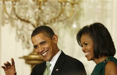 President Barack Obama, First Lady Michelle Obama, and Vice President Joe Biden join Irish Prime Minister Brian Cowen and leaders from Northern Ireland for a St. Patrick's Day reception in the East Room of the White House on March 17, 2009.