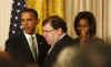 President Barack Obama, First Lady Michelle Obama, and Vice President Joe Biden join Irish Prime Minister Brian Cowen and leaders from Northern Ireland for a St. Patrick's Day reception in the East Room of the White House on March 17, 2009.