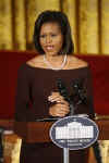 First Lady Michelle Obama hosts a dinner in the East Room of the White House to celebrate Women's History Month.
